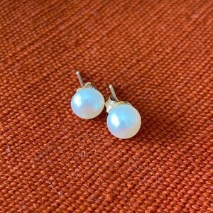 Classic White Pearl Stud Earrings - one 10k. And one 14k. Make a nice pair